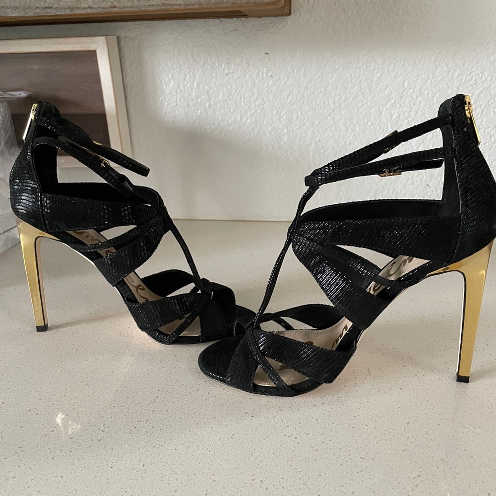 Sam Edelman black shoes with a gold heel.